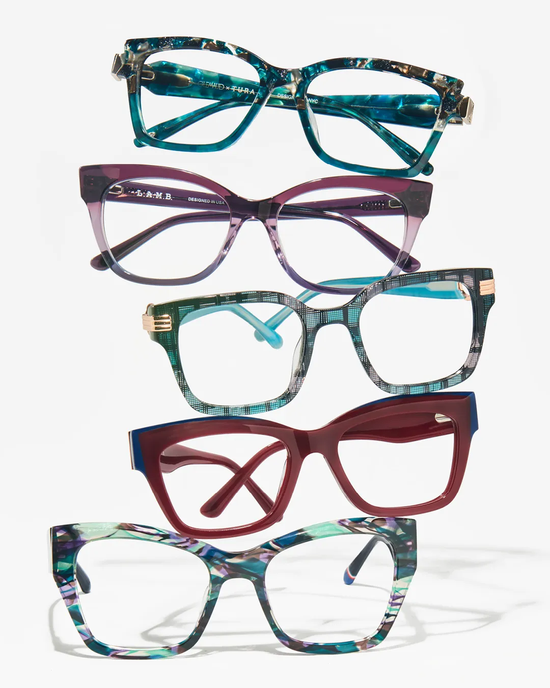 A stack of colorful acetate eyeglass frames carried at Tager Optical